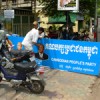 Craftsmen put the finishing touches on a sign promoting the Cambodian People's Party. Credit: Andrew Nette/IPS