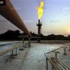 Flare burning off excess gas Credit:  Sven Torfinn  / panos pictures