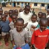 Children gather in front of the newly painted and expanded Rabuor Nursery School. Credit: Rabuor Village Project