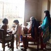 A volunteer speaks with rape survivor Naseema, who has taken refuge in Karachi along with her family.  Credit: Beena Sarwar/IPS 