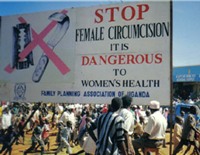 A billboard in Kapchorwa town, which is part of the campaign against female genital mutilation. Credit: Wambi Michael/IPS