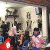 The local salon is a refuge for Vietnamese women, away from work, home and husband.   Credit: Helen Clark/IPS