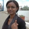 Maria Martin (20) holding up her thumb with the purple mark to show she voted.  Credit: Servaas van den Bosch/IPS