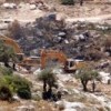 Israeli bulldozers on Palestinian land in Ni'ilin village. Credit: Mel Frykberg