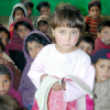 Sheema (an open book in her hands) is in grade 2 at the Government Girls Primary School in Odigram village. She says: "We hadn