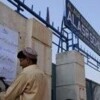 An official of a school in Peshawar posts a notice stating it has been temporarily closed in view of the attacks. Credit: Ashfaq Yusufzai/IPS