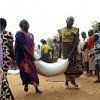 Internally Displaced Persons (IDPs) in Juba, Sudan carry away food and non-food rations supplied by the WFP and UNICEF after attacks on their villages.  Credit: UN Photo/Tim McKulka 
