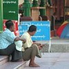 Vigilantes of the junta sponsored Swan Arr Shin organisation sit around the Shwedagon Pagoda --security forces were kept out of sight for Pinheiro&#39s visit  Credit: Mizzima 