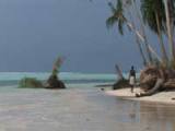 A native of one of the islands of Carteret, in Papua-New Guinea, follows the coastline eroded by ever-higher tides. - Indigenous Summit A native of one of the islands of Carteret, in Papua-New Guinea, follows the coastline eroded by ever-higher tides. - Indigenous Summit