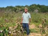 Francisco Soares Oliveira in his field. His maize and bean crops were lost to this year's unusual floods. - Mario Osava/IPS Francisco Soares Oliveira in his field. His maize and bean crops were lost to this year's unusual floods. - Mario Osava/IPS