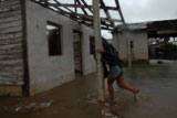 In Pinar del Río, a woman returns to her house, which was damaged by Hurricane Ike. - Jorge Luis Baños/IPS In Pinar del Río, a woman returns to her house, which was damaged by Hurricane Ike. - Jorge Luis Baños/IPS