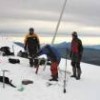 Ecuadorean and French scientists take samples from the Antisana glacier. In the background, to the left, rises Cotopaxi, one of the world's highest active volcanoes. - Courtesy of Bernard Francou/IRD