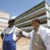 Modesto Bravo, head of construction, converses with surgeon Yosvany Tamayo, director of Héroes de Baíre Hospital, in Nueva Gerona, Cuba. - Jorge Luis Baños/IPS