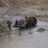 Caudalosa workers clean up mining tailings in the Opamayo River - Milagros Salazar/IPS