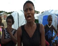 Residents of the Sentra Park Camp listen as Marie Lucie Martel, 21, talks. / Credit:Haiti Grassroots Watch