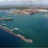 The green areas behind the Suape port, seen here from the Atlantic Ocean, have been set aside for environmental conservation. - Courtesy of Suape Port Complex
