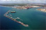 The green areas behind the Suape port, seen here from the Atlantic Ocean, have been set aside for environmental conservation. - Courtesy of Suape Port Complex