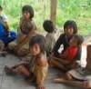 Nanti women and children, members of an indigenous community in initial contact with Western culture in the Peruvian region of Madre de Dios. - INDEPA